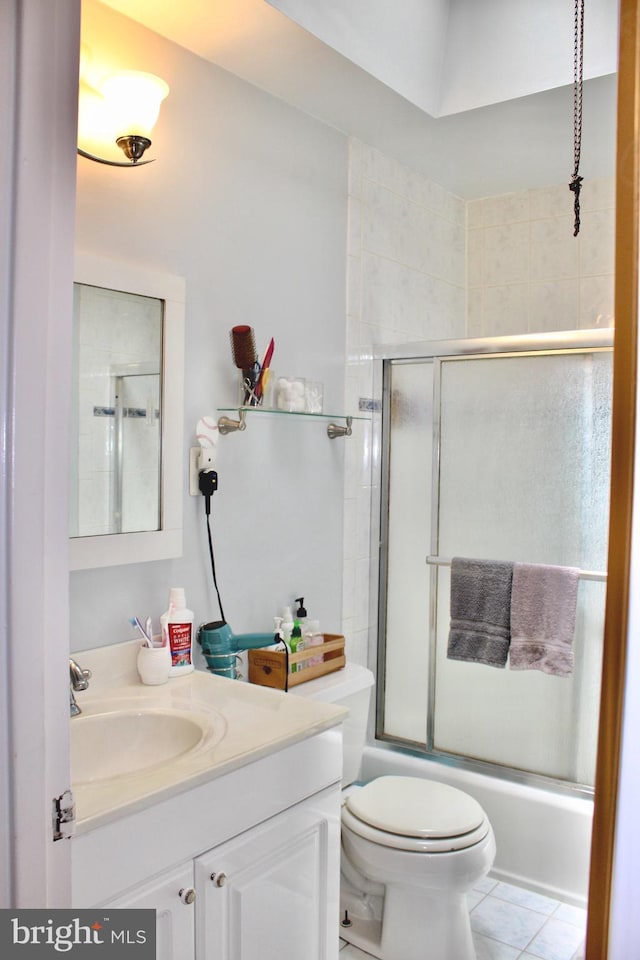 4520 Strahle St, Philadelphia, PA 19136 - bathroom with vanity, combined bath / shower with glass door, toilet, and tile patterned flooring