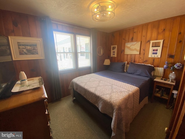 5515 Long Bch Unit 5, Beach Haven, NJ 08008 - bedroom with carpet floors, a textured ceiling, and wooden walls