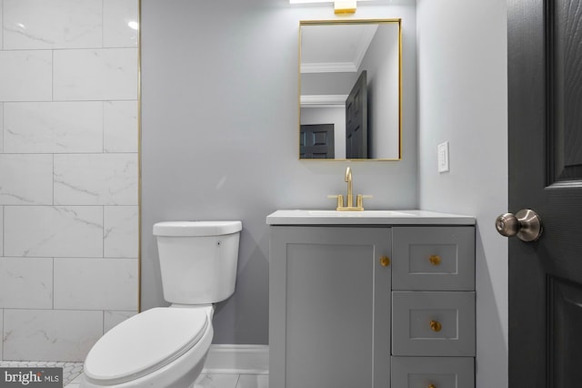 1513 N Wolfe St, Baltimore, MD 21213 - bathroom with ornamental molding, toilet, vanity, baseboards, and marble finish floors