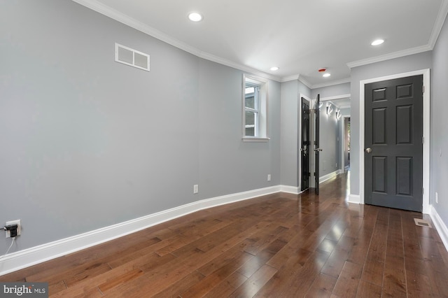 1513 N Wolfe St, Baltimore, MD 21213 - entryway with dark wood-style flooring, baseboards, recessed lighting, and ornamental molding