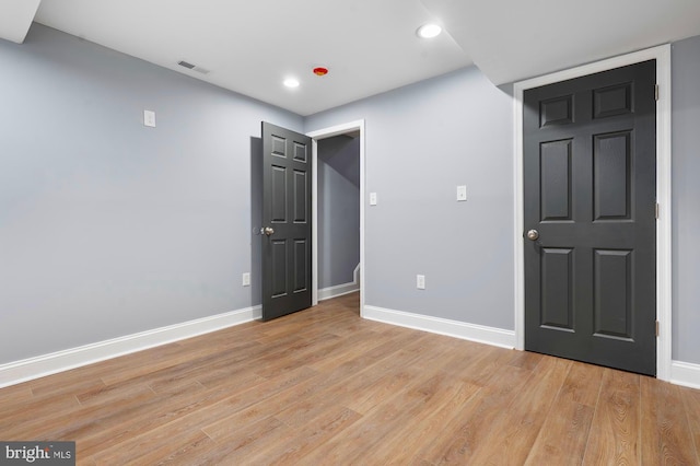 1513 N Wolfe St, Baltimore, MD 21213 - unfurnished bedroom featuring baseboards, light wood finished floors, and recessed lighting