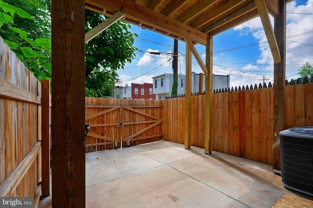 1513 N Wolfe St, Baltimore, MD 21213 - view of patio with central air condition unit and a gate