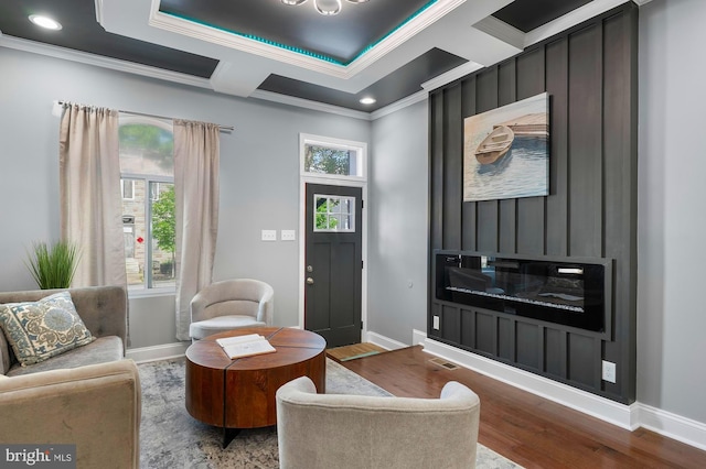1513 N Wolfe St, Baltimore, MD 21213 - living area with crown molding, baseboards, wood finished floors, and recessed lighting
