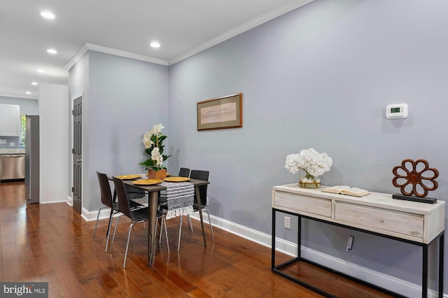 1513 N Wolfe St, Baltimore, MD 21213 - dining room featuring crown molding, dark wood-style flooring, baseboards, and recessed lighting