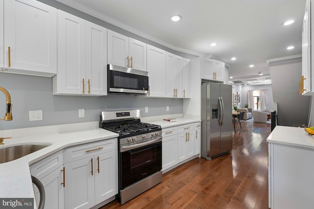 1513 N Wolfe St, Baltimore, MD 21213 - kitchen featuring appliances with stainless steel finishes, a sink, crown molding, white cabinets, and recessed lighting