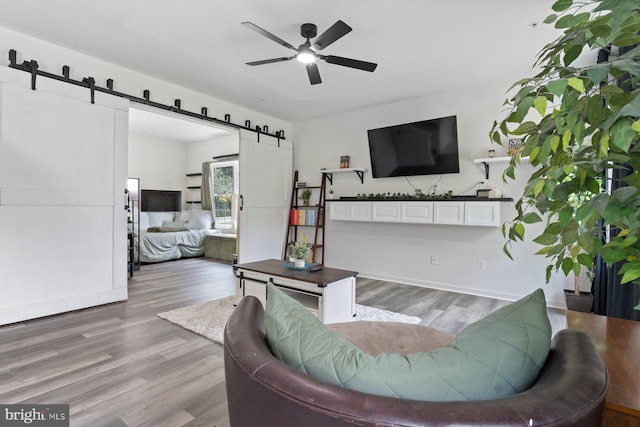 1408 Canopy Ln, Odenton, MD 21113 - living room with a barn door, wood finished floors, and a ceiling fan