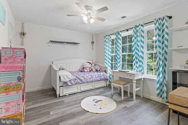 1408 Canopy Ln, Odenton, MD 21113 - bedroom featuring wood finished floors, multiple windows, and a ceiling fan