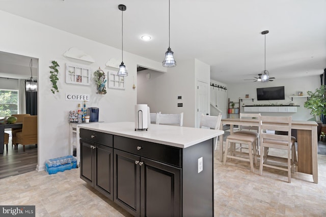 1408 Canopy Ln, Odenton, MD 21113 - kitchen with ceiling fan, decorative light fixtures, light countertops, open floor plan, and a kitchen island