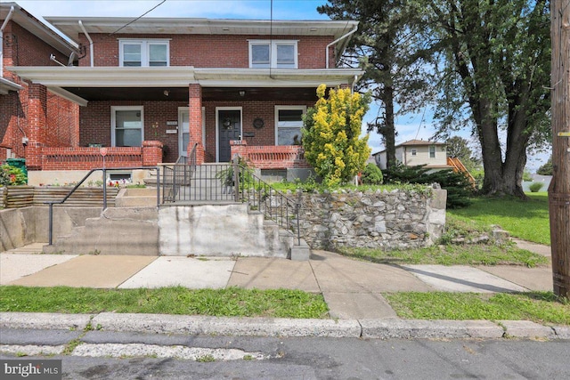 937 Fern Ave, Reading, PA 19607 - view of front facade featuring brick siding and covered porch