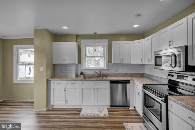 937 Fern Ave, Reading, PA 19607 - kitchen with appliances with stainless steel finishes, a sink, healthy amount of natural light, white cabinetry, and recessed lighting