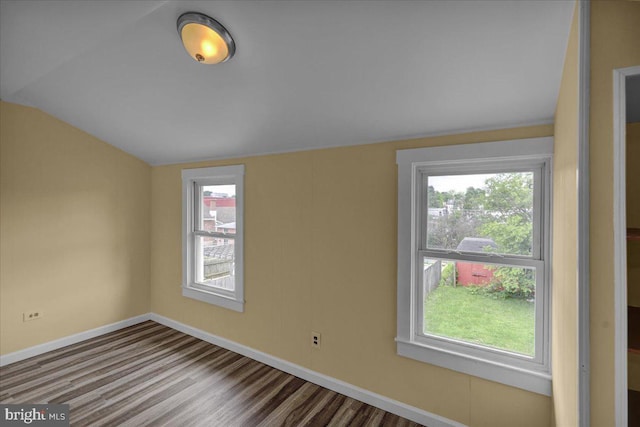 937 Fern Ave, Reading, PA 19607 - empty room with vaulted ceiling, baseboards, and wood finished floors