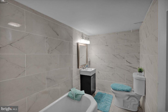 937 Fern Ave, Reading, PA 19607 - bathroom with toilet, tile walls, a tub, and vanity