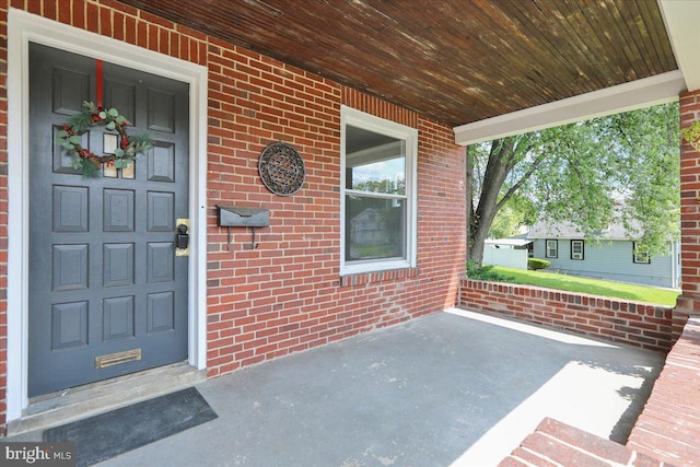 937 Fern Ave, Reading, PA 19607 - property entrance with covered porch and brick siding