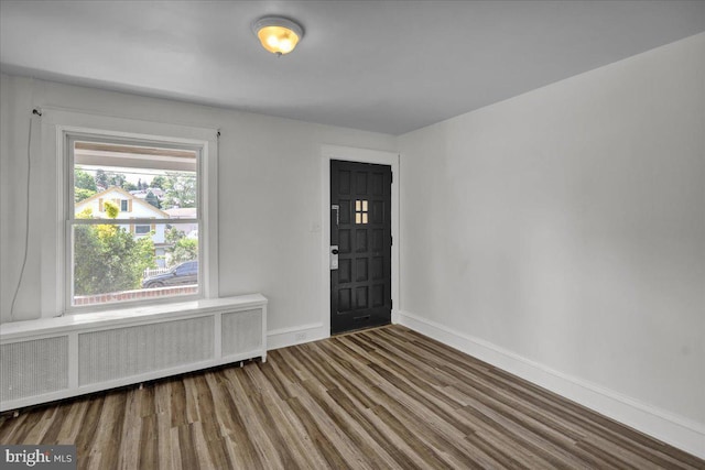 937 Fern Ave, Reading, PA 19607 - foyer entrance featuring radiator heating unit, baseboards, and wood finished floors