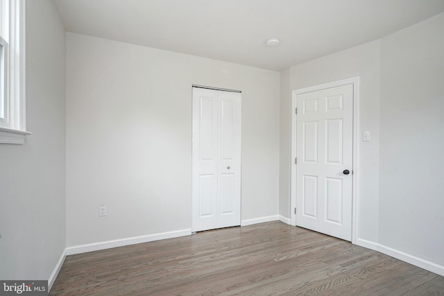26 Jefferson Dr, Clementon, NJ 08021 - unfurnished bedroom featuring wood finished floors, a closet, and baseboards