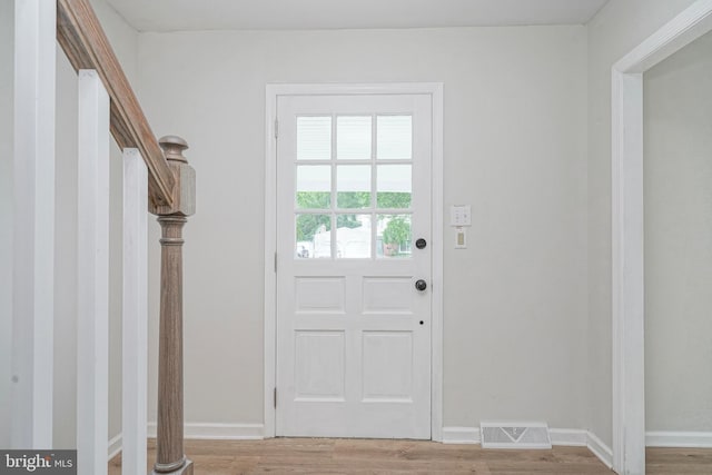 26 Jefferson Dr, Clementon, NJ 08021 - doorway to outside with light wood-style flooring and baseboards
