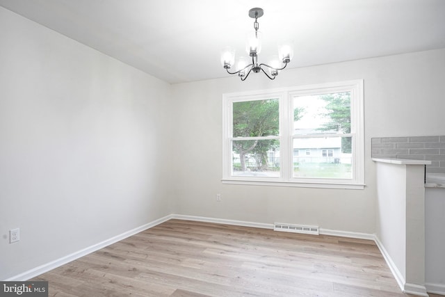 26 Jefferson Dr, Clementon, NJ 08021 - unfurnished dining area featuring a chandelier, light wood-type flooring, and baseboards