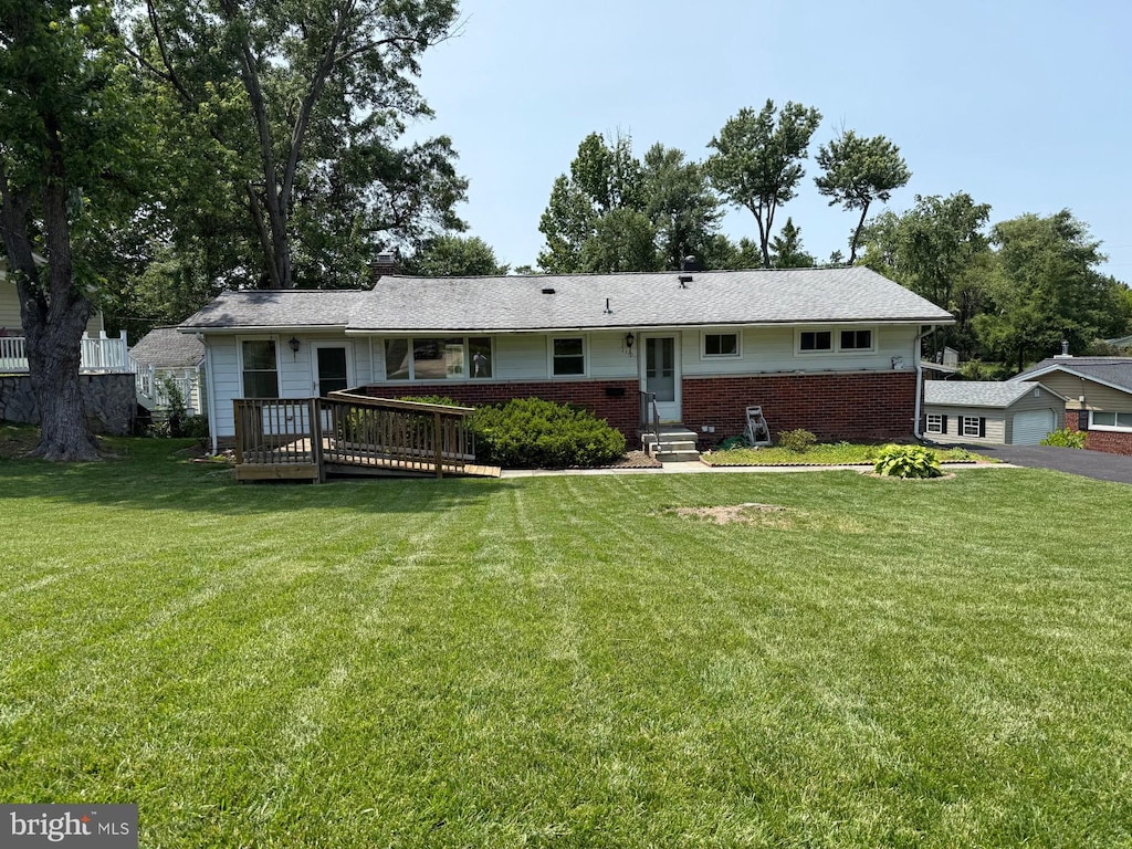 6310 Saddle Tree Dr, Alexandria, VA 22310 - single story home with brick siding, a front lawn, a garage, a deck, and entry steps