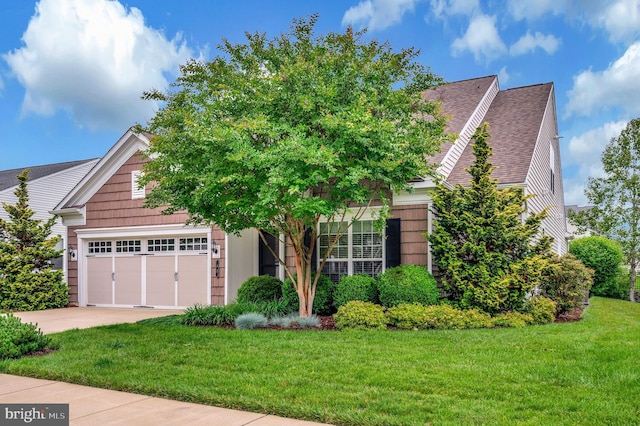 43 Battery Point Dr, Fredericksburg, VA 22406 - view of property hidden behind natural elements featuring concrete driveway, a front lawn, an attached garage, and roof with shingles