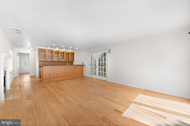 1131 Long Beach Blvd, Long Beach Township, NJ 08008 - unfurnished living room featuring recessed lighting, a fireplace, light wood-style floors, baseboards, and bar area