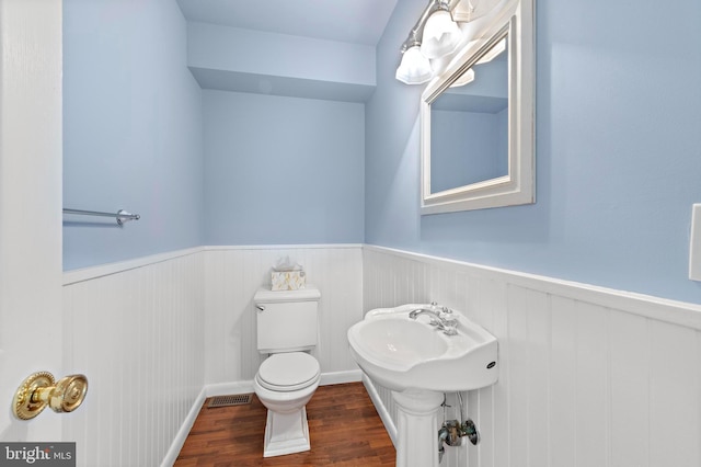 1131 Long Beach Blvd, Long Beach Township, NJ 08008 - bathroom featuring wainscoting, toilet, and wood finished floors