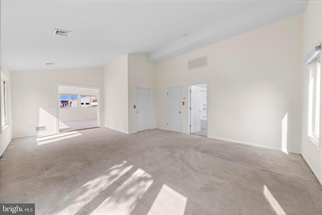 1131 Long Beach Blvd, Long Beach Township, NJ 08008 - unfurnished living room featuring lofted ceiling, carpet flooring, and baseboards