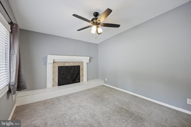 1013 S Scott Ave, Lindenwold, NJ 08021 - unfurnished living room with carpet, ceiling fan, a tiled fireplace, and healthy amount of natural light