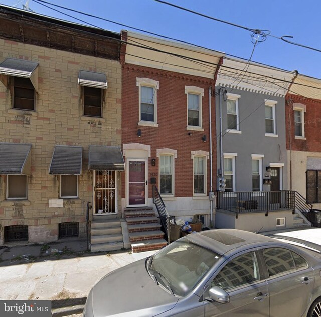 1430 N 24th St, Philadelphia, PA 19121 - view of property with brick siding and entry steps