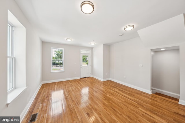 141 NE V St NE, Washington, DC 20002 - empty room with light wood-style flooring and baseboards