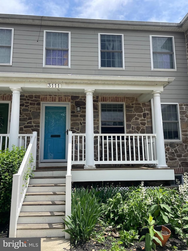 3111 Tilden Dr, Baltimore, MD 21211 - view of front of property with stone siding and covered porch