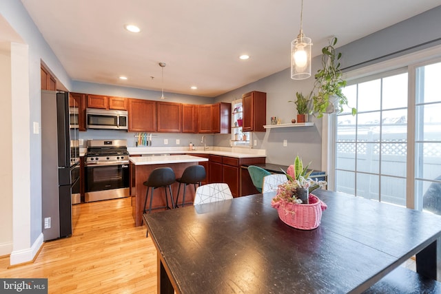 3111 Tilden Dr, Baltimore, MD 21211 - kitchen with appliances with stainless steel finishes, light wood-style flooring, a sink, open shelves, and recessed lighting