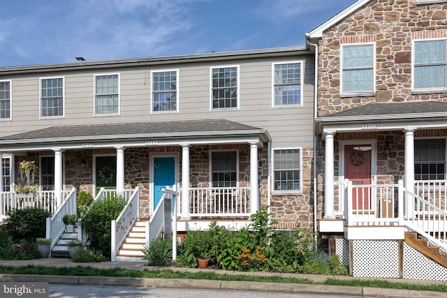 3111 Tilden Dr, Baltimore, MD 21211 - multi unit property featuring stone siding, a porch, and stairway