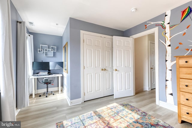3111 Tilden Dr, Baltimore, MD 21211 - bedroom featuring wood finished floors, an office area, a closet, and baseboards