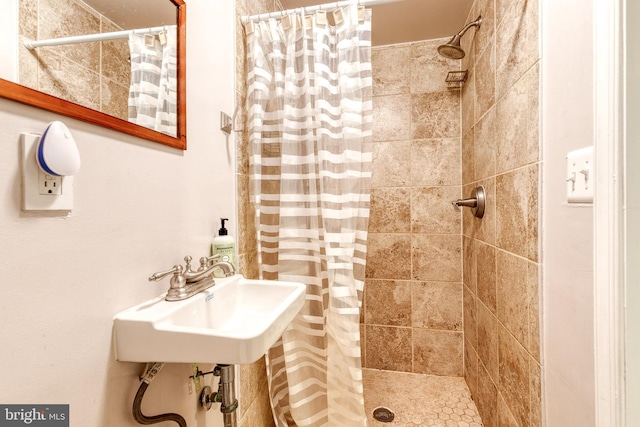 3111 Tilden Dr, Baltimore, MD 21211 - full bathroom featuring a tile shower and a sink