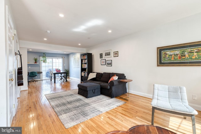 3111 Tilden Dr, Baltimore, MD 21211 - living room with light wood finished floors, baseboards, and recessed lighting