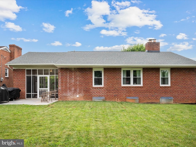 117 Washington Ave, Front Royal, VA 22630 - back of house with a patio, a lawn, and brick siding