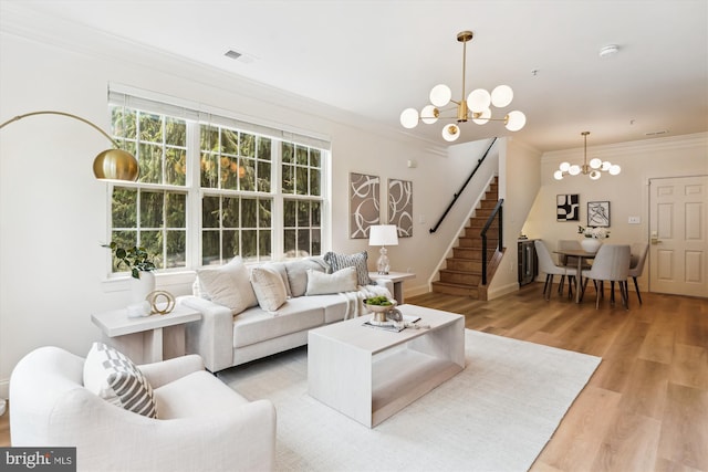 604 Highland Ridge Ave Unit 100, Gaithersburg, MD 20878 - living room featuring a chandelier, ornamental molding, stairway, and light wood-type flooring