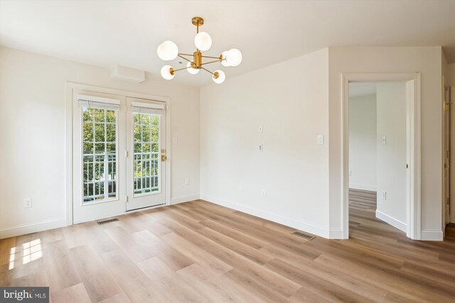 604 Highland Ridge Ave Unit 100, Gaithersburg, MD 20878 - unfurnished dining area featuring light wood-type flooring and a chandelier