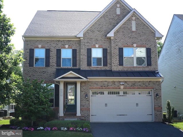 9073 Bear Branch Pl, Fairfax, VA 22031 - view of front of property with brick siding, asphalt driveway, an attached garage, and a standing seam roof