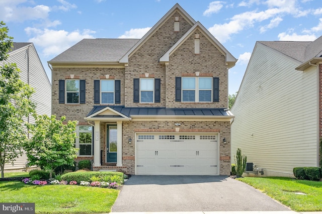 9073 Bear Branch Pl, Fairfax, VA 22031 - view of front facade with brick siding, asphalt driveway, an attached garage, a front yard, and central AC unit