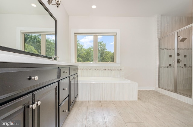 9073 Bear Branch Pl, Fairfax, VA 22031 - full bath featuring healthy amount of natural light, a stall shower, vanity, a garden tub, and recessed lighting