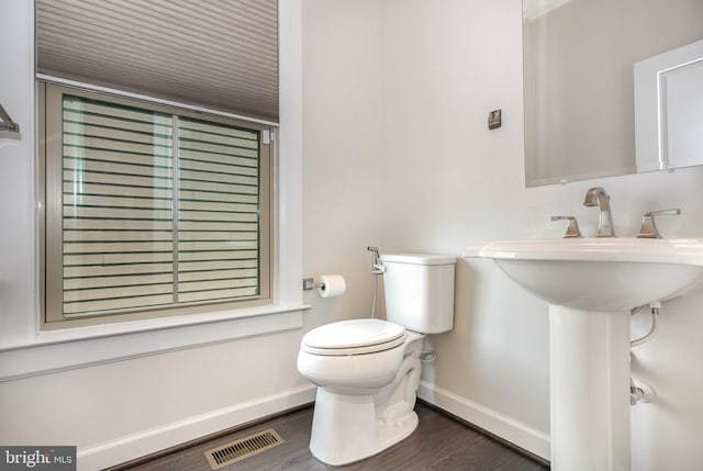 9073 Bear Branch Pl, Fairfax, VA 22031 - half bathroom with toilet, wood finished floors, and baseboards