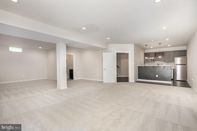 9073 Bear Branch Pl, Fairfax, VA 22031 - unfurnished living room featuring light carpet, recessed lighting, and baseboards