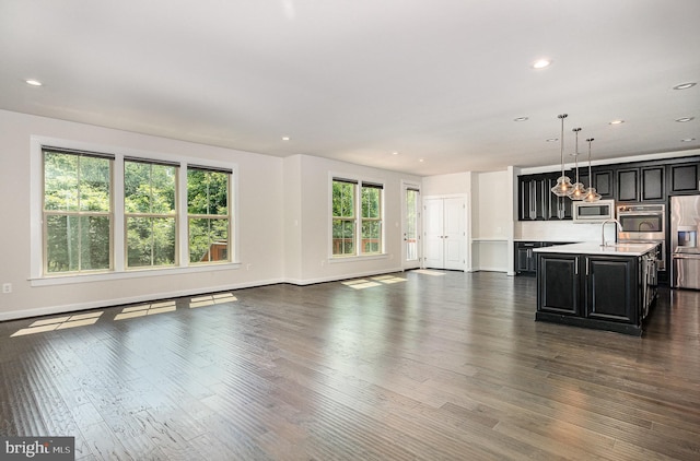 9073 Bear Branch Pl, Fairfax, VA 22031 - unfurnished living room featuring dark wood-style floors, recessed lighting, baseboards, a baseboard radiator, and a chandelier