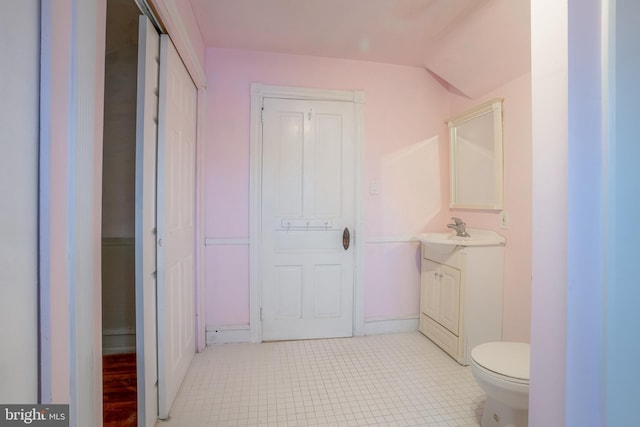 122 Merion Ave, Narberth, PA 19072 - half bathroom featuring vanity, toilet, and baseboards