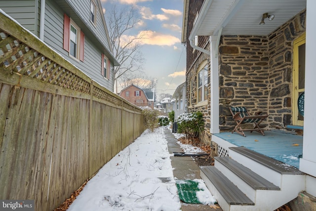122 Merion Ave, Narberth, PA 19072 - property exterior at dusk featuring a wooden deck and stone siding