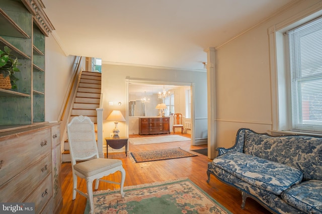 122 Merion Ave, Narberth, PA 19072 - living area featuring stairway, hardwood / wood-style flooring, a chandelier, plenty of natural light, and ornamental molding