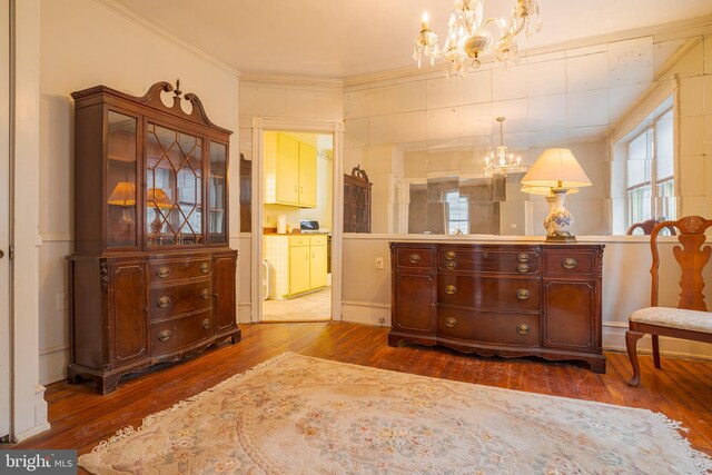 122 Merion Ave, Narberth, PA 19072 - living area with a chandelier, dark wood finished floors, and crown molding