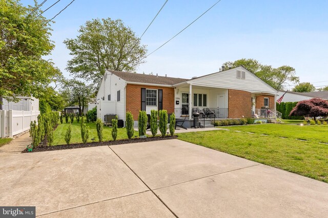 1350 Virginia Ave, Cape May, NJ 08204 - view of front facade featuring brick siding and covered porch