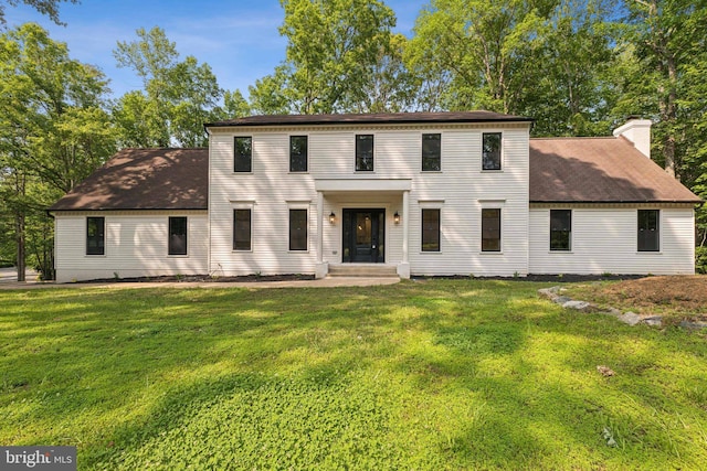 13505 Richie Ct, Manassas, VA 20112 - colonial home with a front yard, a chimney, and a shingled roof